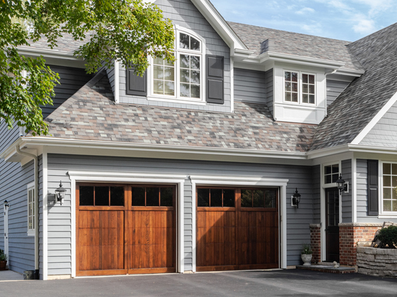 a house in front of a brick building